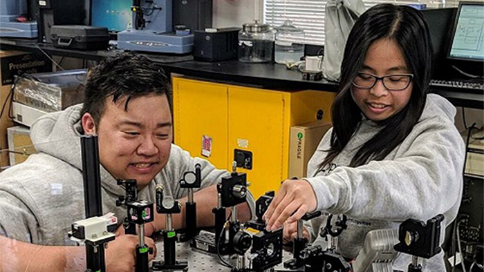 Nha Uyen Huynh (Ph.D.) and Richard Lee (MEng) working on the development of a novel approach to characterize nontraditional materials using terahertz radiation