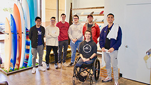 Students Collin Beaty, Dominic Castillo, Dylan Doan, Dante Legaspi, Anders Ohrstrom, Dustin Ybarra taking a picture with US Army Veteran, Mr. Jordan Sisco.